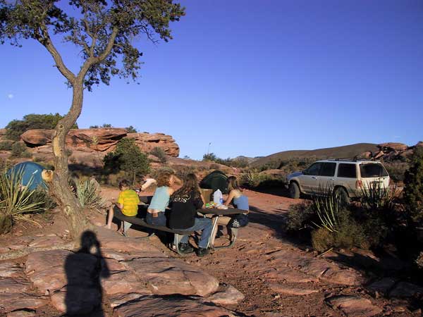 Shadow of the photographer, picknick table with family