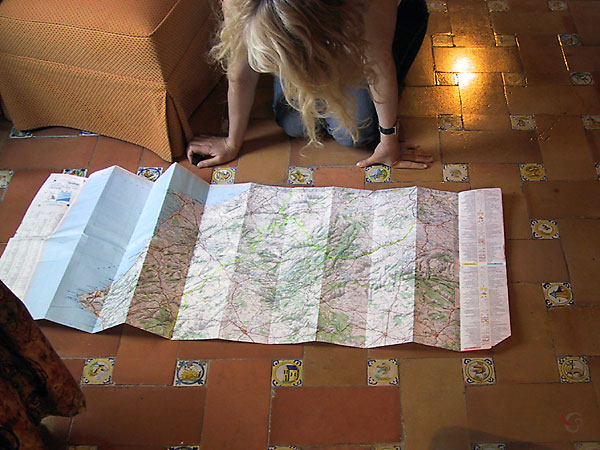 Sylvia looking at the map, spread ou on the floor