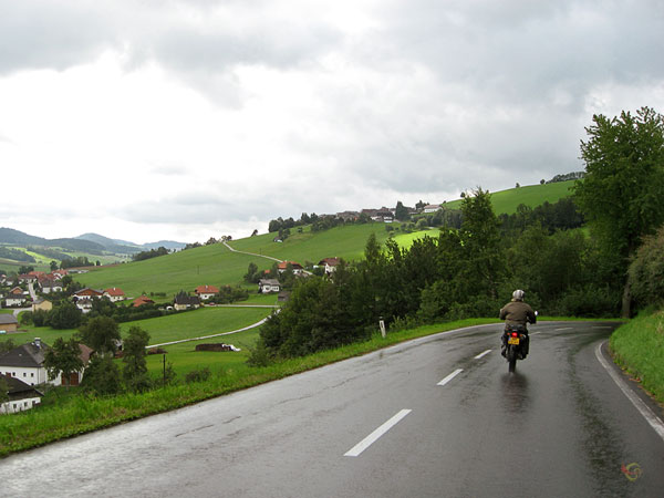 Green hills, white houses, a curvy road